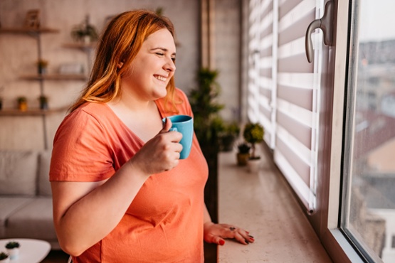 Lady drinking a cup of coffee