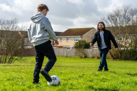 two people playing football