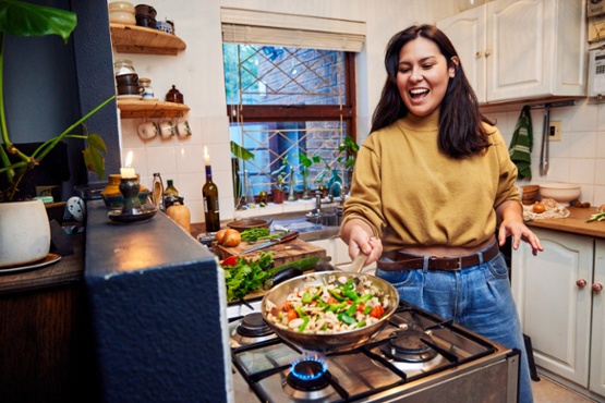 Lady cooking in kitchen